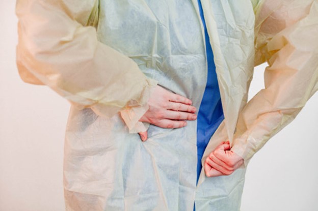 donning rear panels of gown