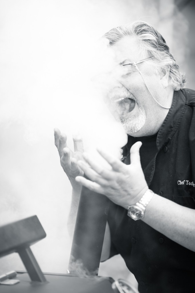 * Chef Ted Reader enjoying the smokey aroma pouring out of the Yoder Smoker! 