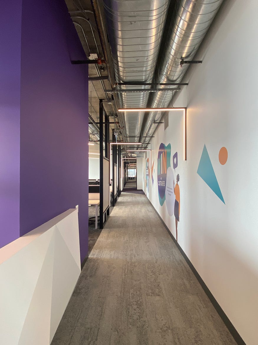 Hallway detail showing 90° wall mounted light fixtures.