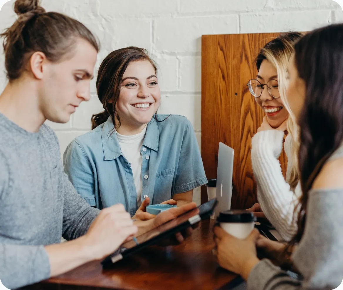 a group of people sitting around a table