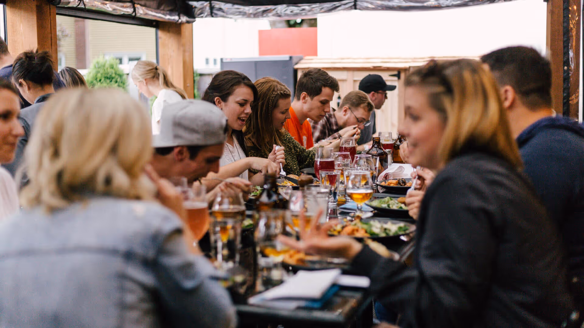 Busy group of people out for dinner and drinks