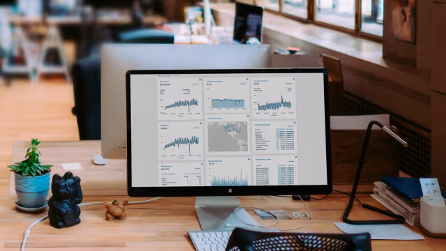 Desktop monitor with MOBI Analytics dashboard open