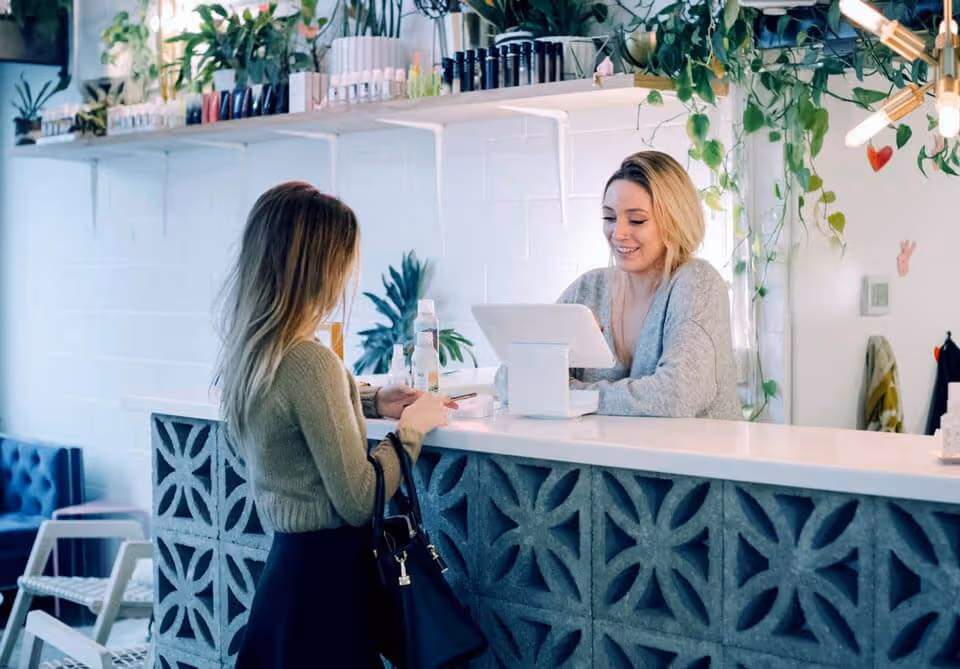 Guest checking in with hotel front deck