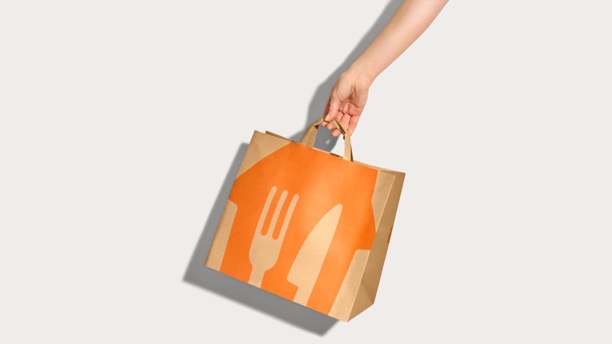 Split-screen graphic showing delivery cost comparison and a delivery cyclist. Left side displays MOBI calculator results: $20,000 in aggregator sales, $6,000 in delivery fees, $2,650 in white-label delivery costs, and $3,350 in monthly savings. Right side shows a courier riding a bicycle next to a map with defined delivery zones.