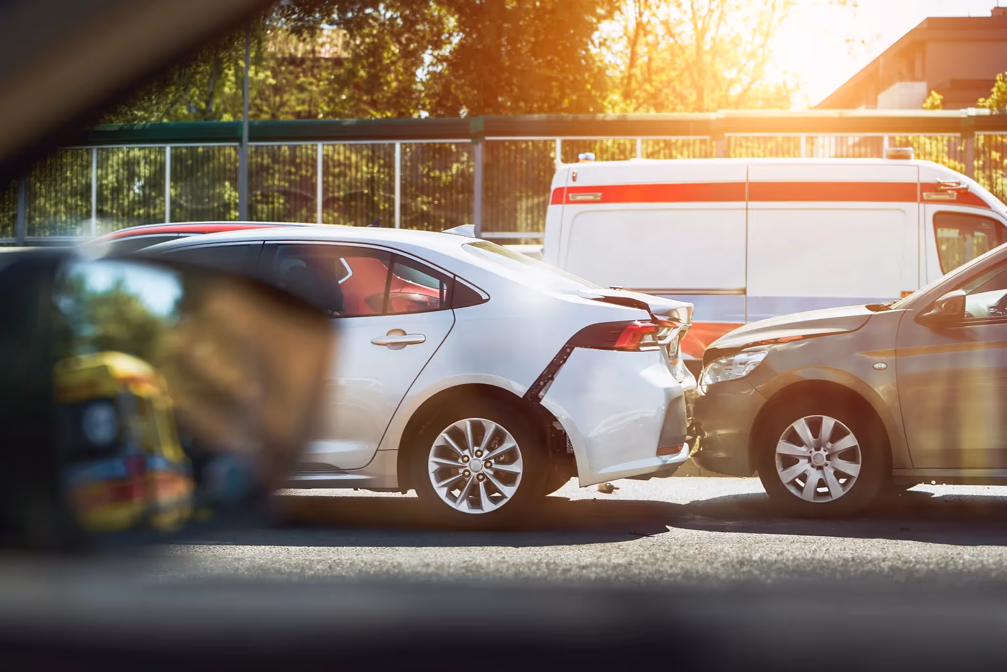 Car rear-ending a white vehicle in a Phoenix traffic accident