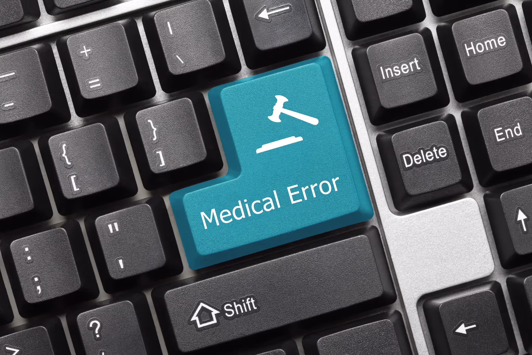 Keyboard with green enter key labeled medical error