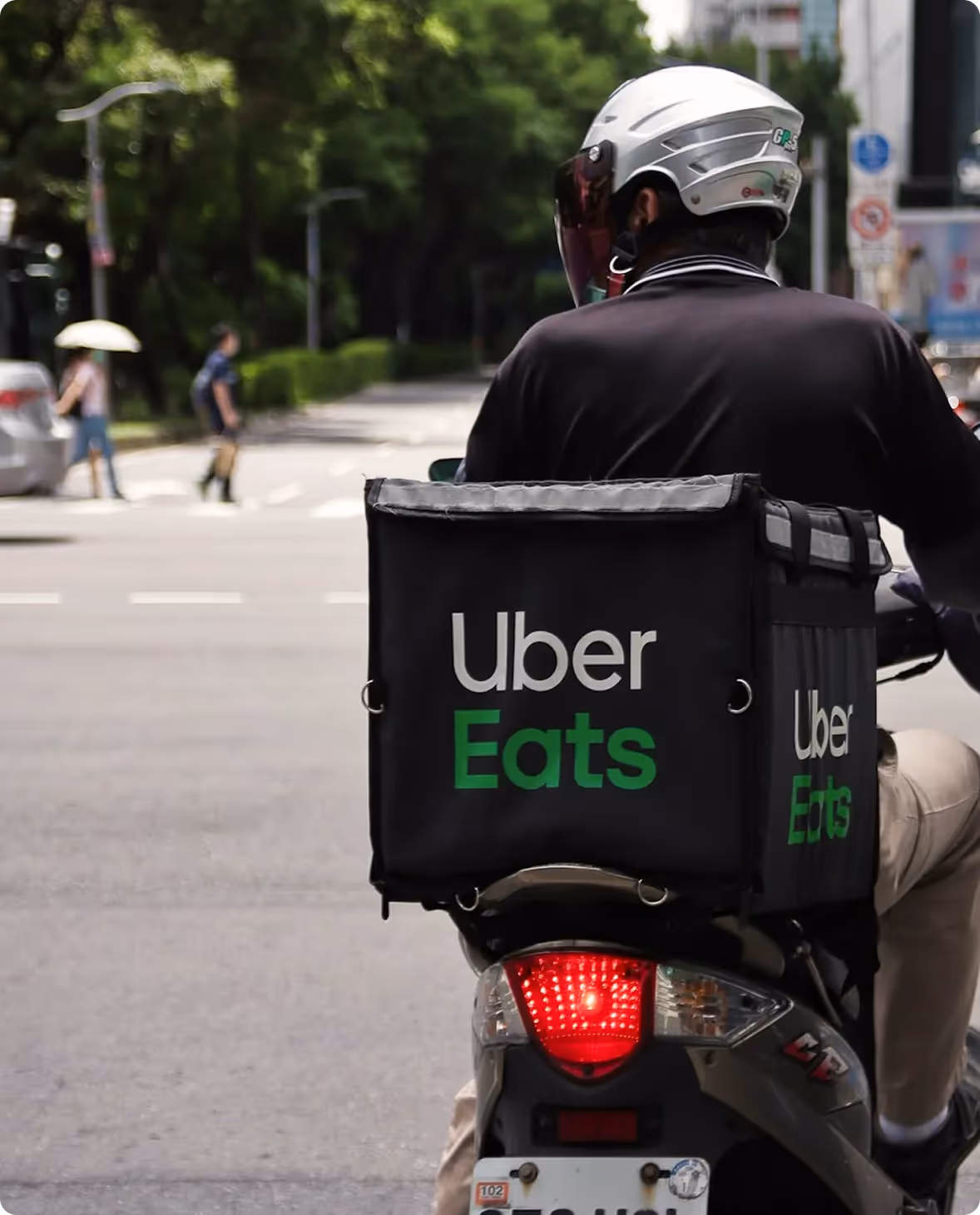 Uber Eats delivery driver riding a bike on the street
