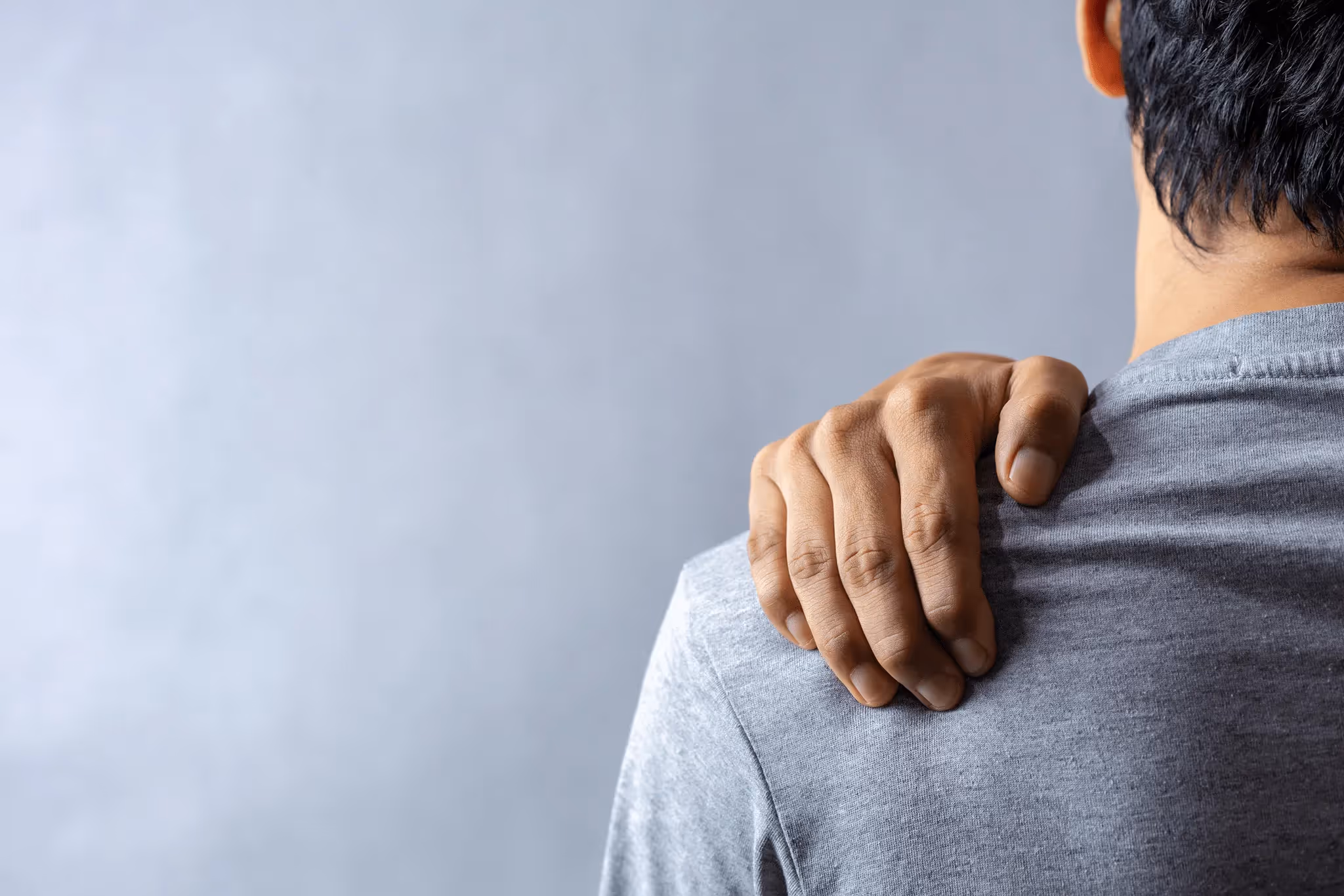 Man suffering from shoulder pain after an accident in California