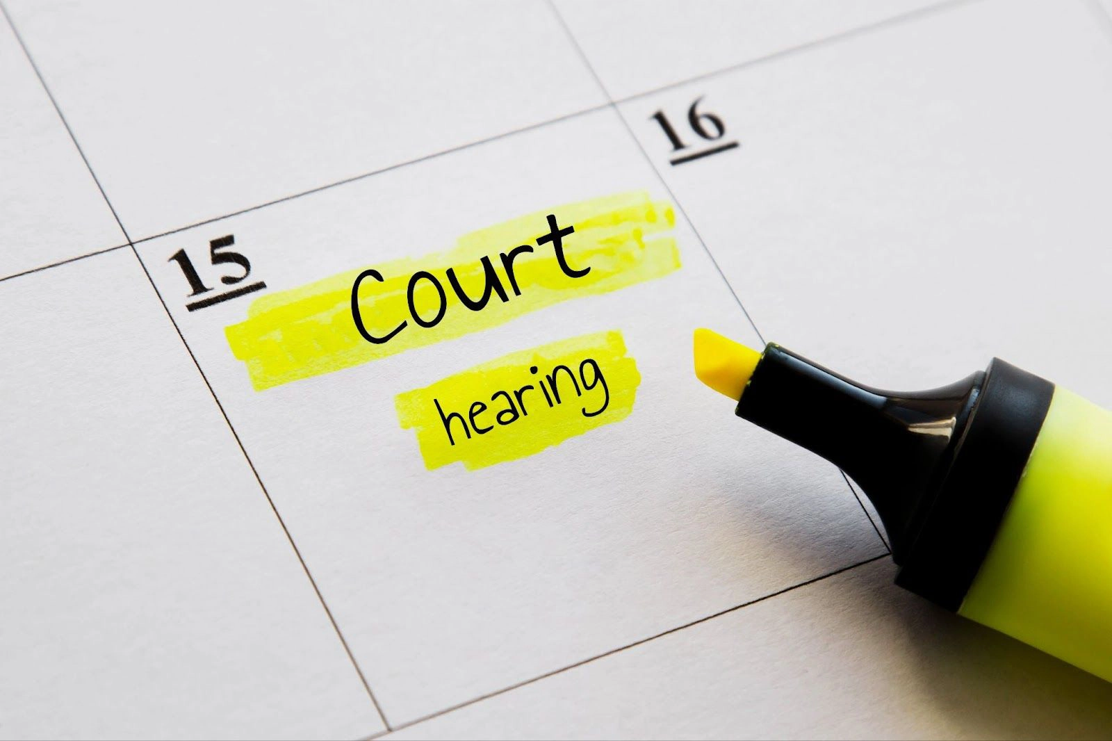 A calendar with court hearing penciled in