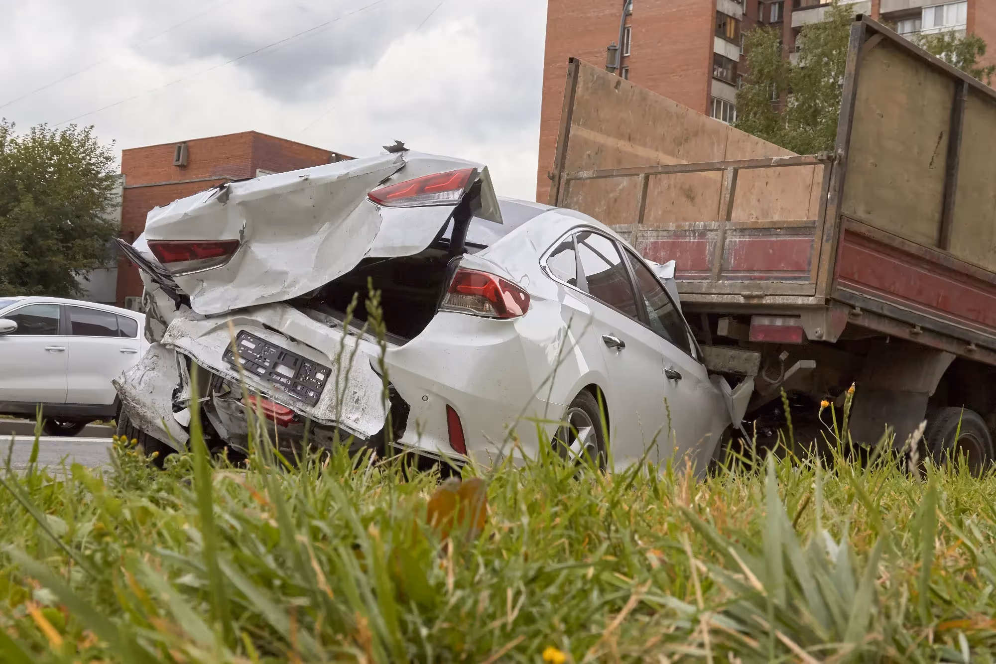 White car heavily damaged after being rear-ended in an Atlanta Uber accident