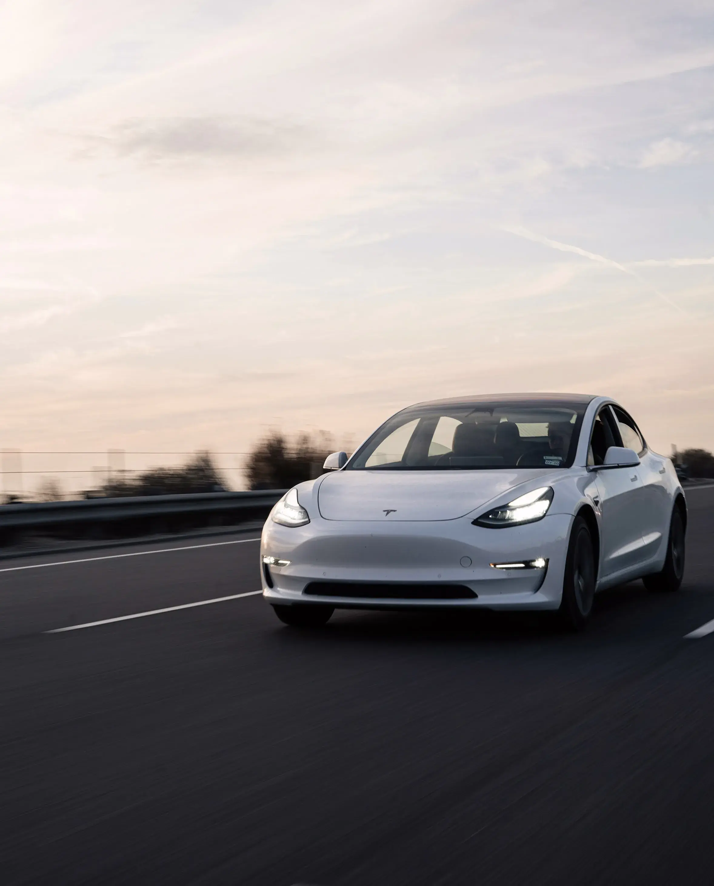 white tesla on road