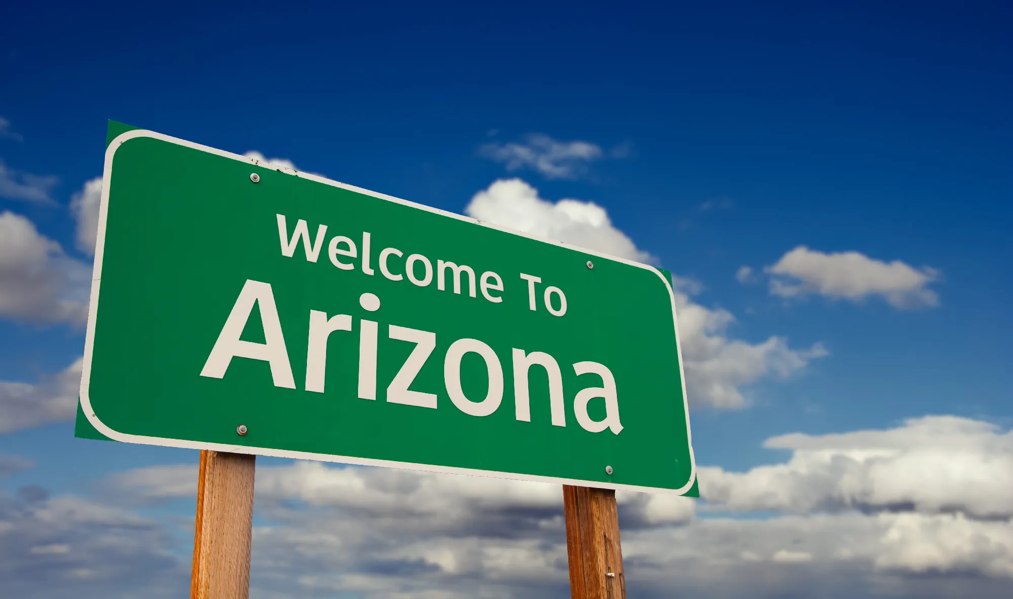 Welcome to Arizona sign against a blue sky