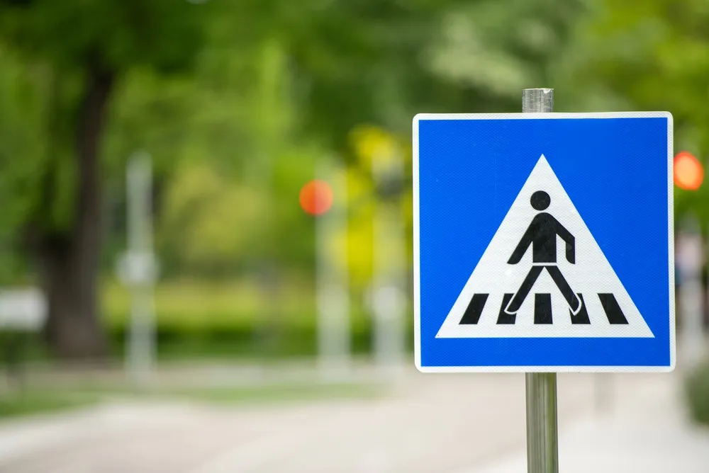 Pedestrian crossing sign on a street in Los Angeles