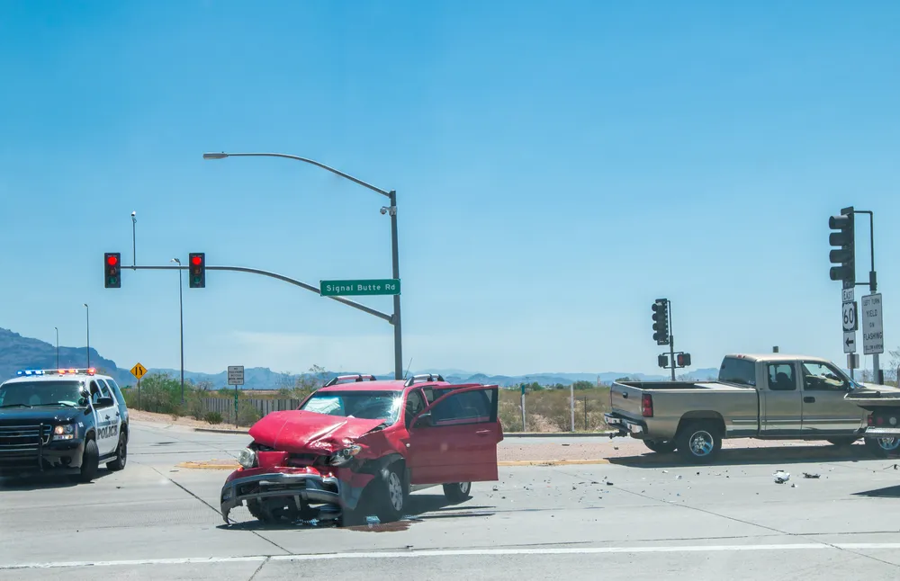 Red SUV and pickup truck after a crash at a Phoenix intersection