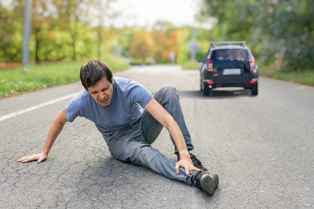 Injured pedestrian on the road after a hit-and-run accident in Atlanta