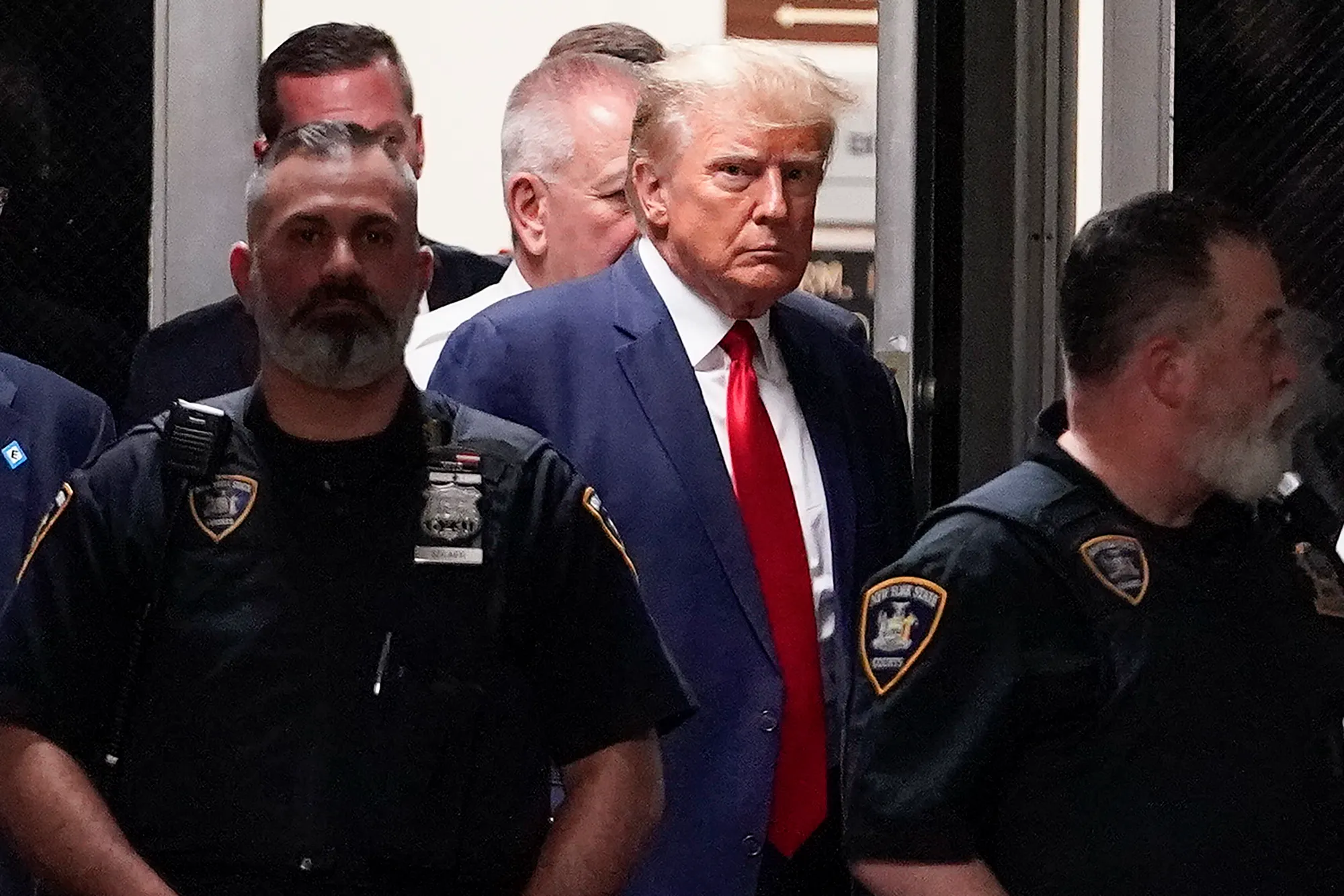 Former President Donald Trump entering courtrrom.