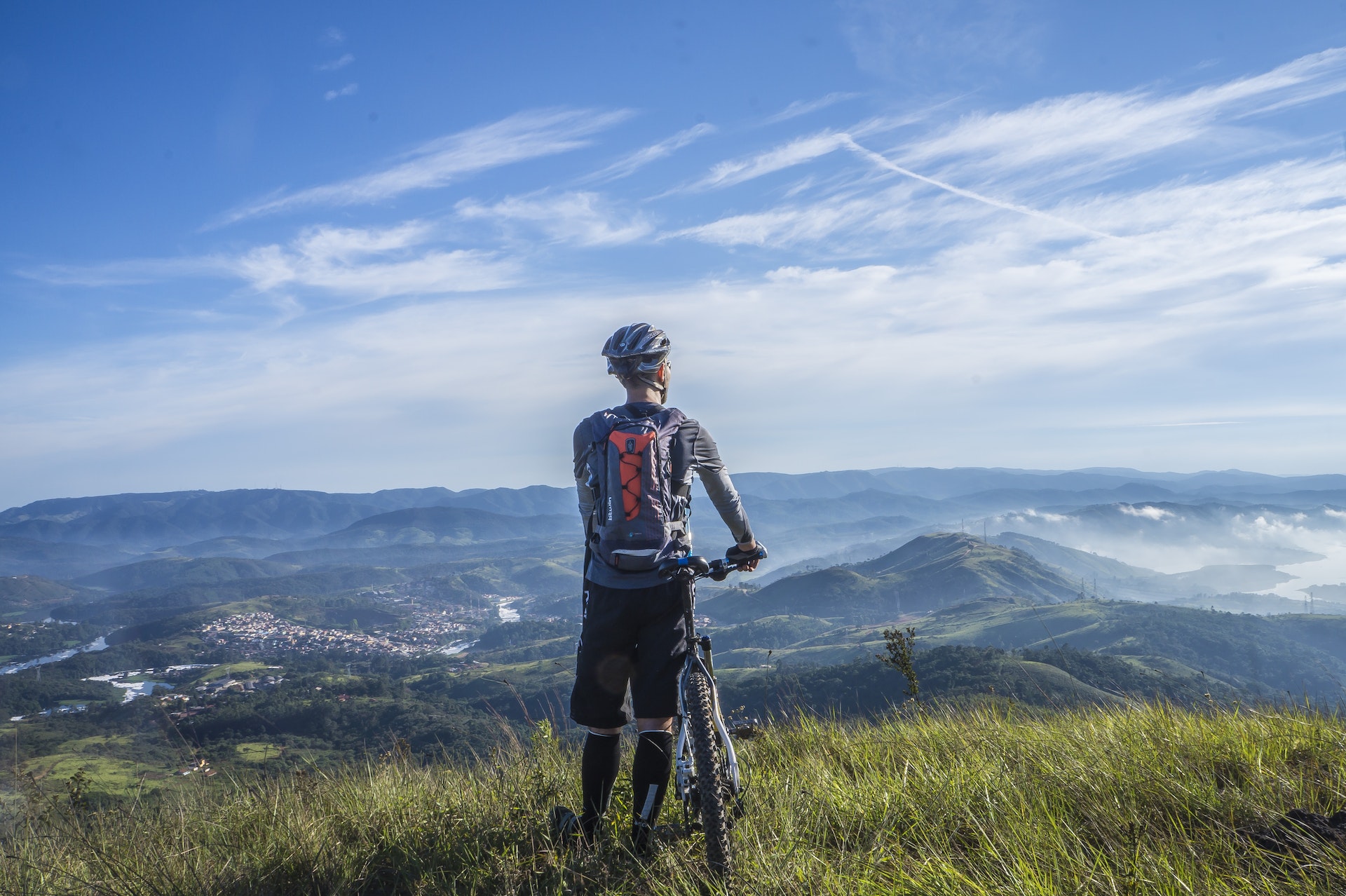 Mountain biker looking out over a mountain landscape