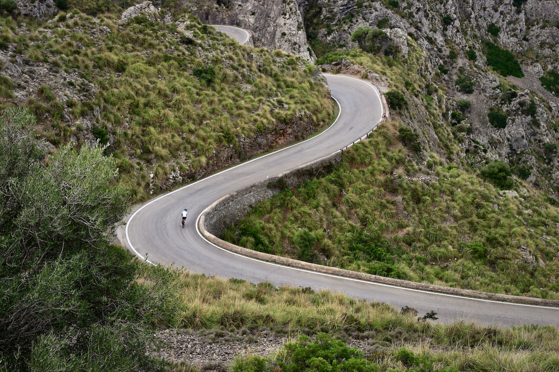 Cyclist on a winding mountain road