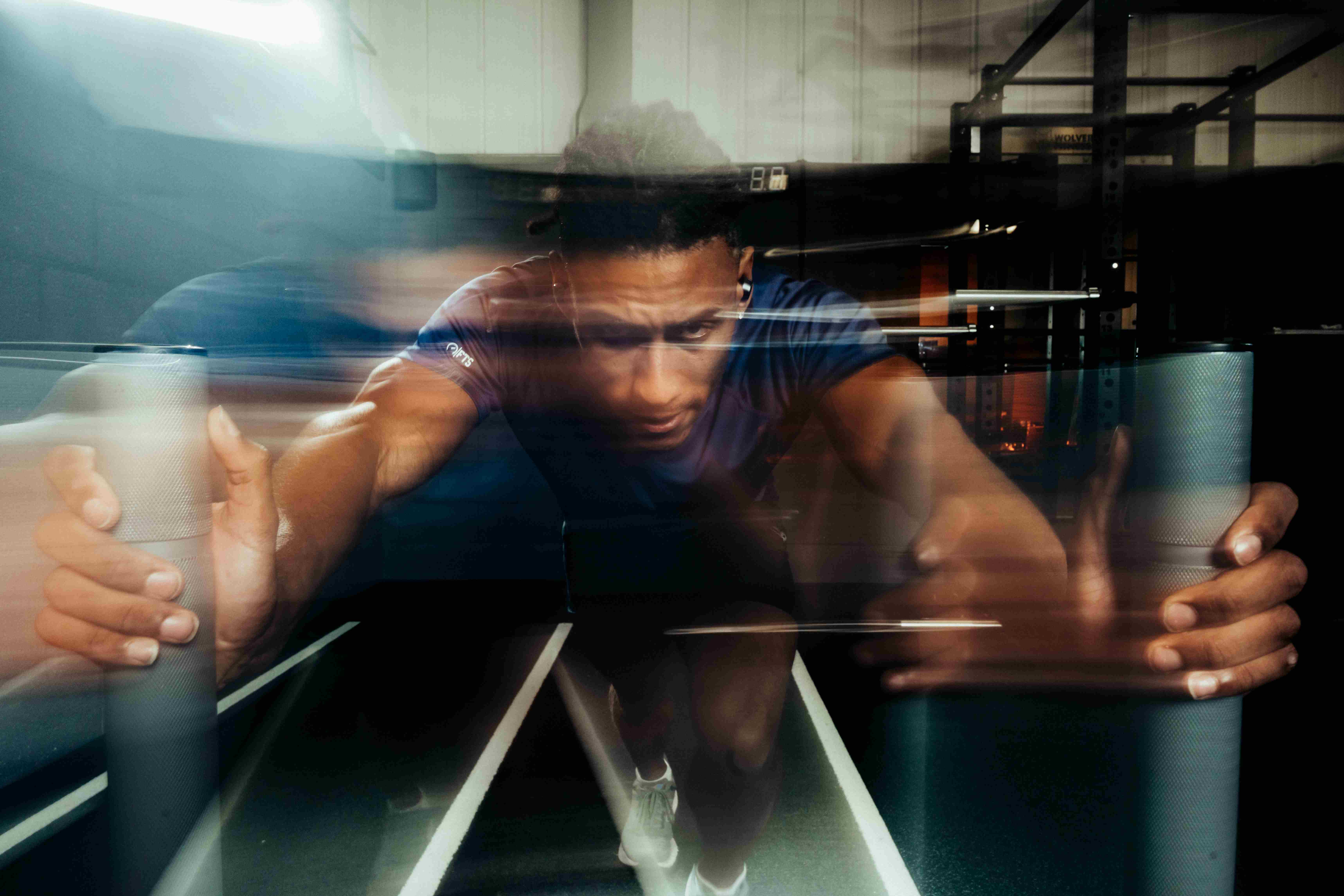 Athlete wearing Tzuka workout earbuds proven not to break during gym training