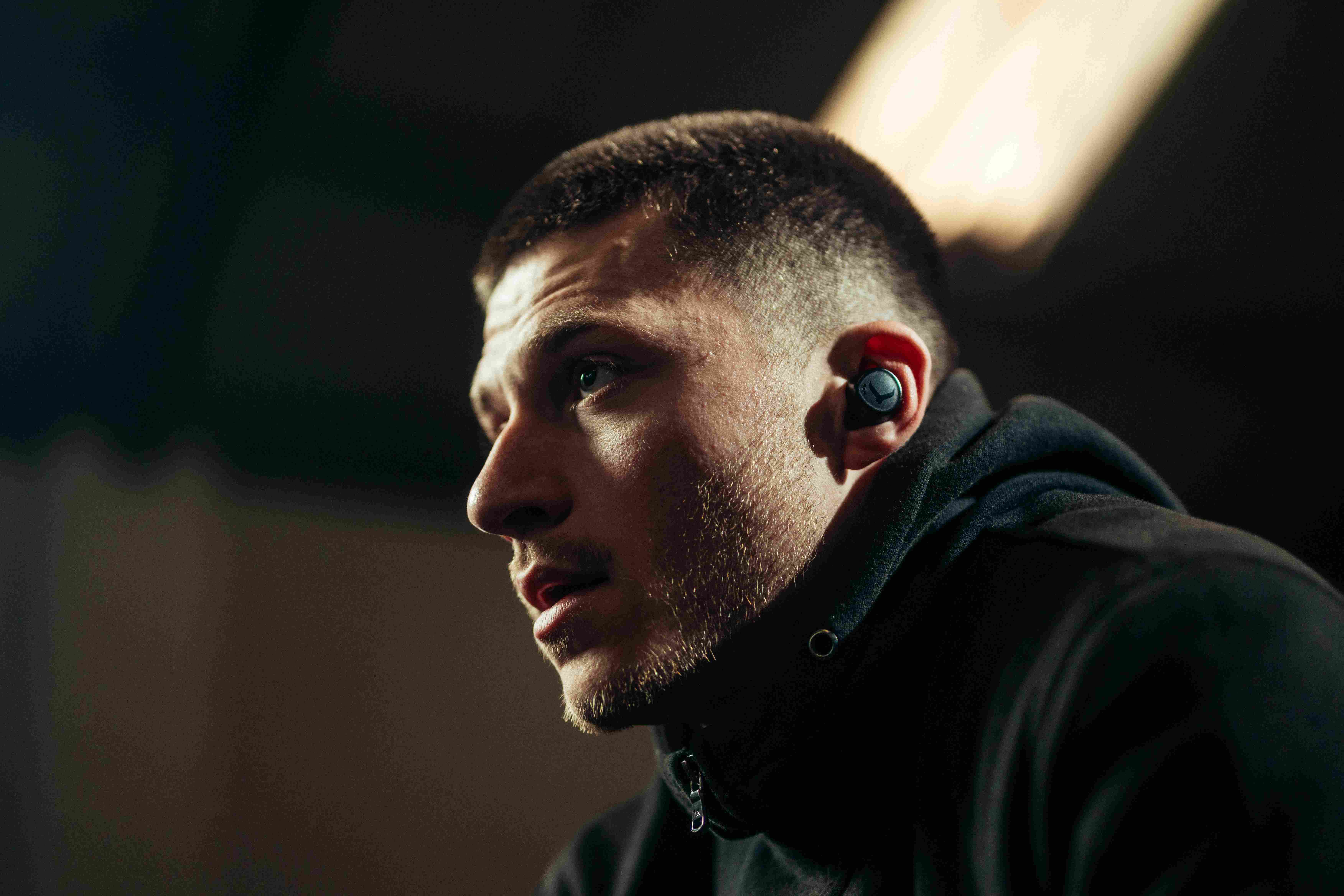 Phone-free workout earbuds worn during gym training session
