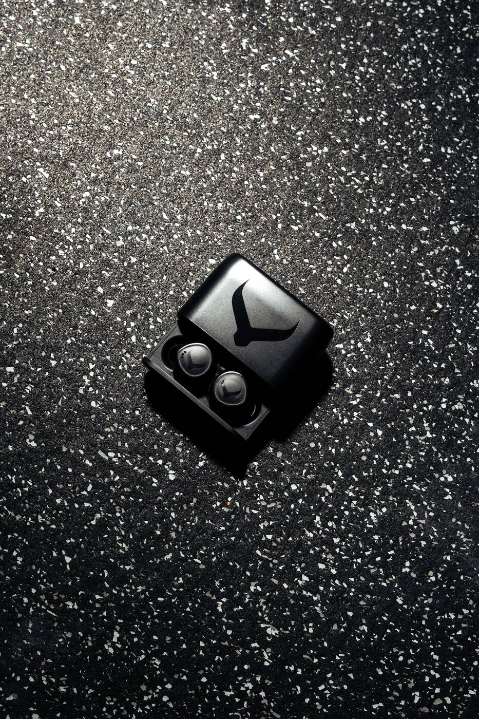 Tzuka TZ7 Ultra earbuds in their open charging case