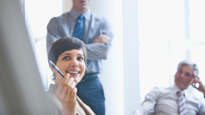 Woman smiling in a business meeting