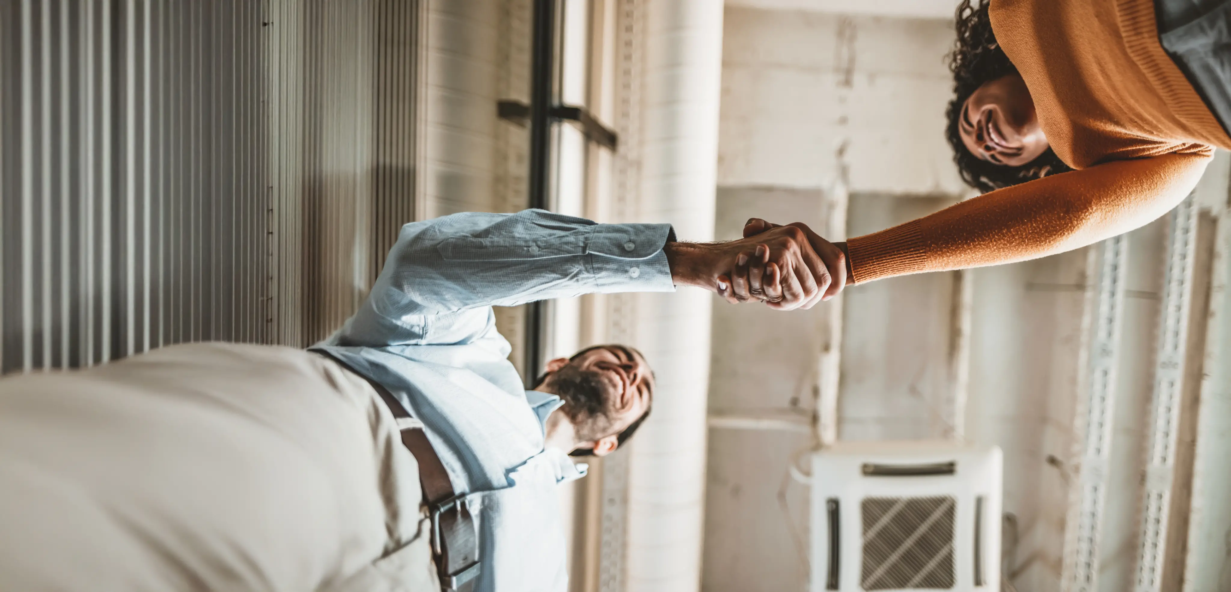 A man and a woman shaking hands