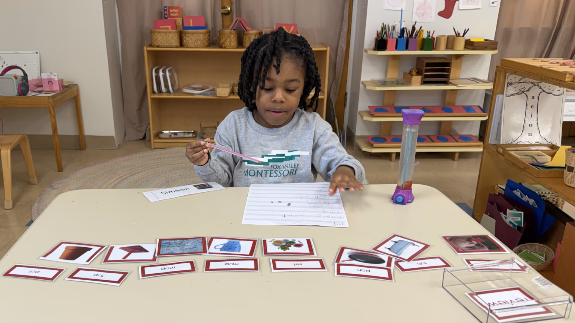 fox-valley-montessori-school-student-organizing-items-in-classroom