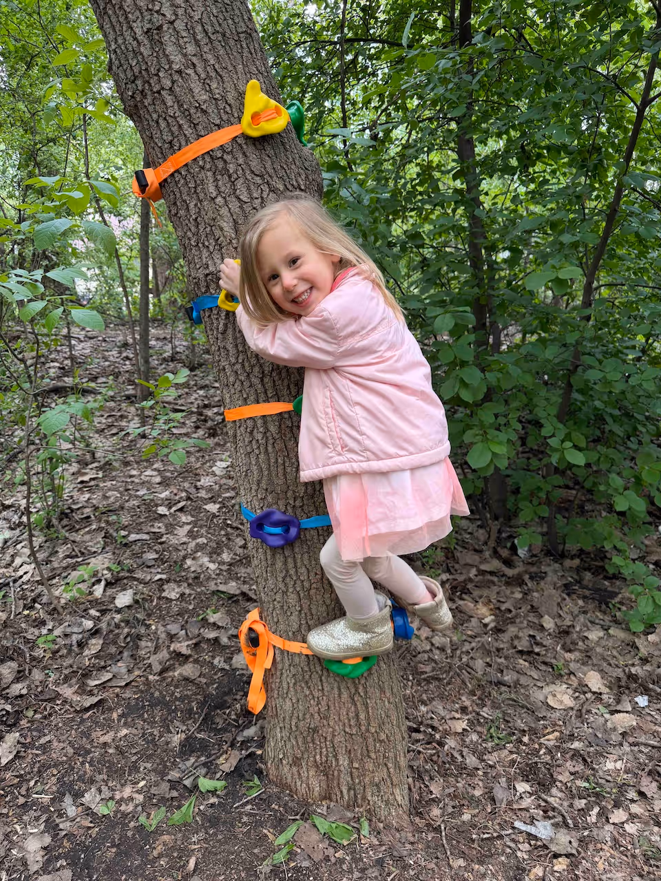 fox-valley-montessori-student-climbing-a-tree-outside