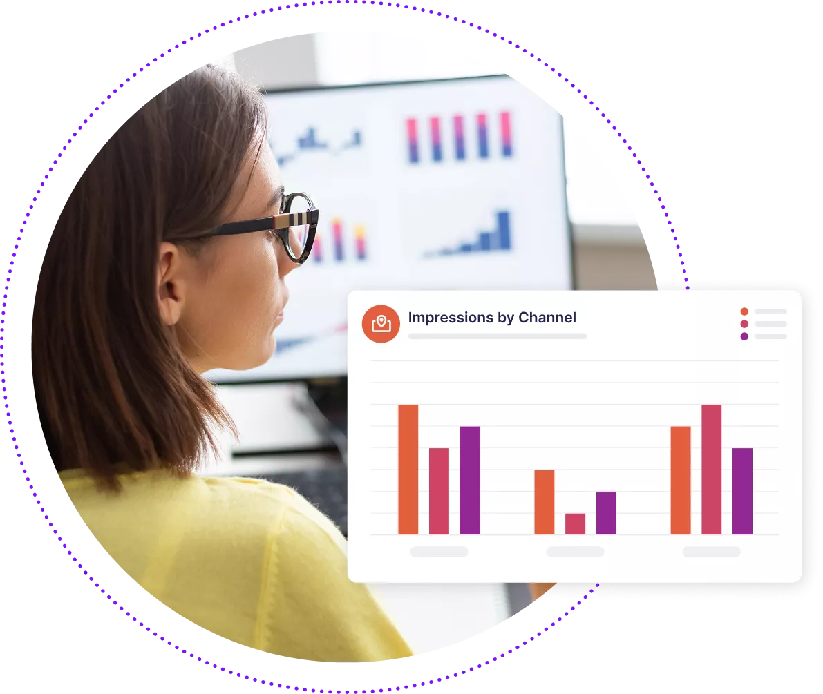 Business woman looking at data charts on her computer