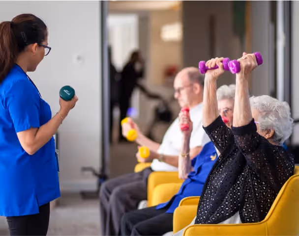 Oxa Care residents enjoying a group exercise session with staff.