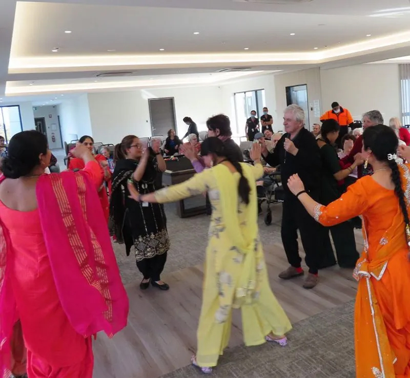 Oxa Care residents and staff celebrating together with dancing.