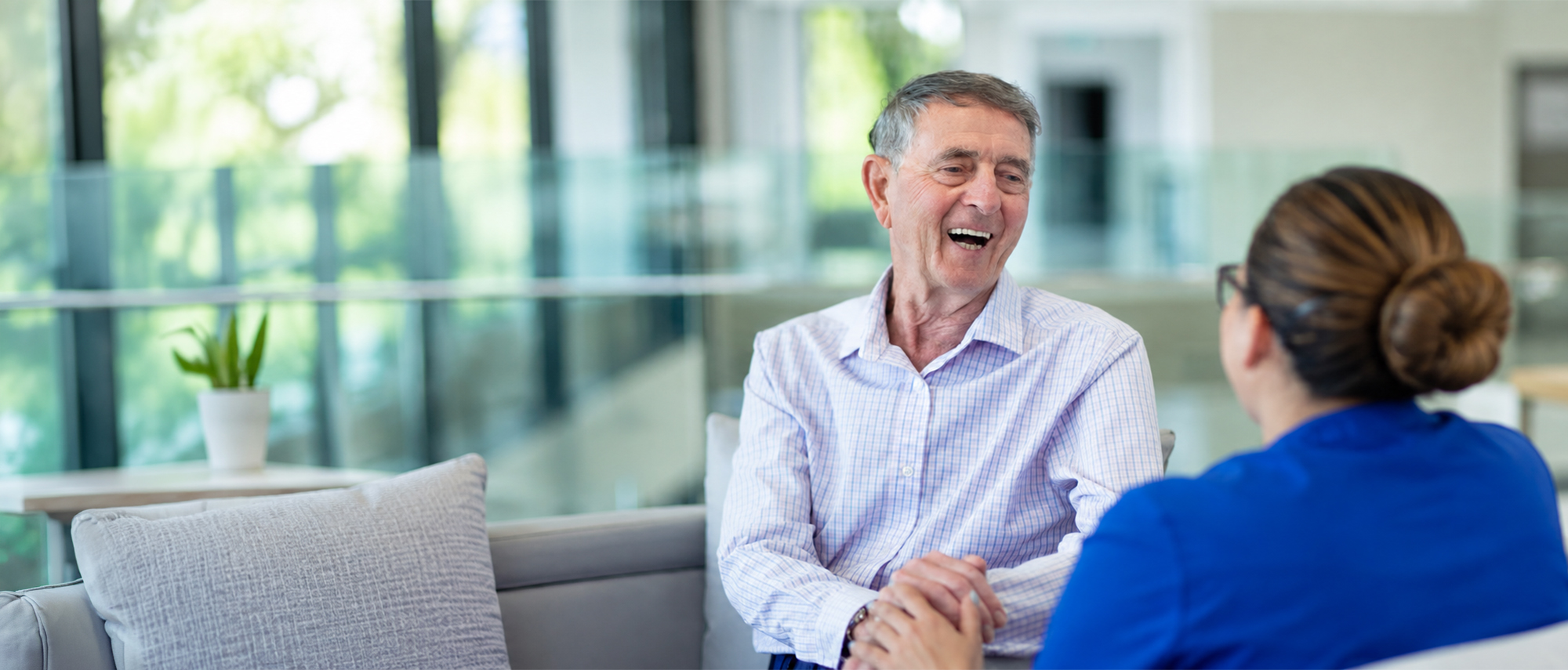 Oxa Care resident having a friendly conversation with a staff member.