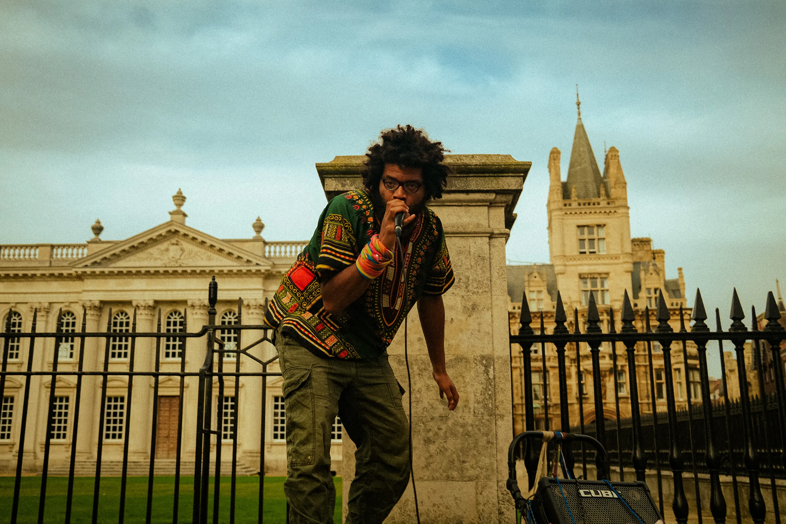 A black street busker free styling in front of the Kings College in Cambridge. Shot with the Fujifilm x100v