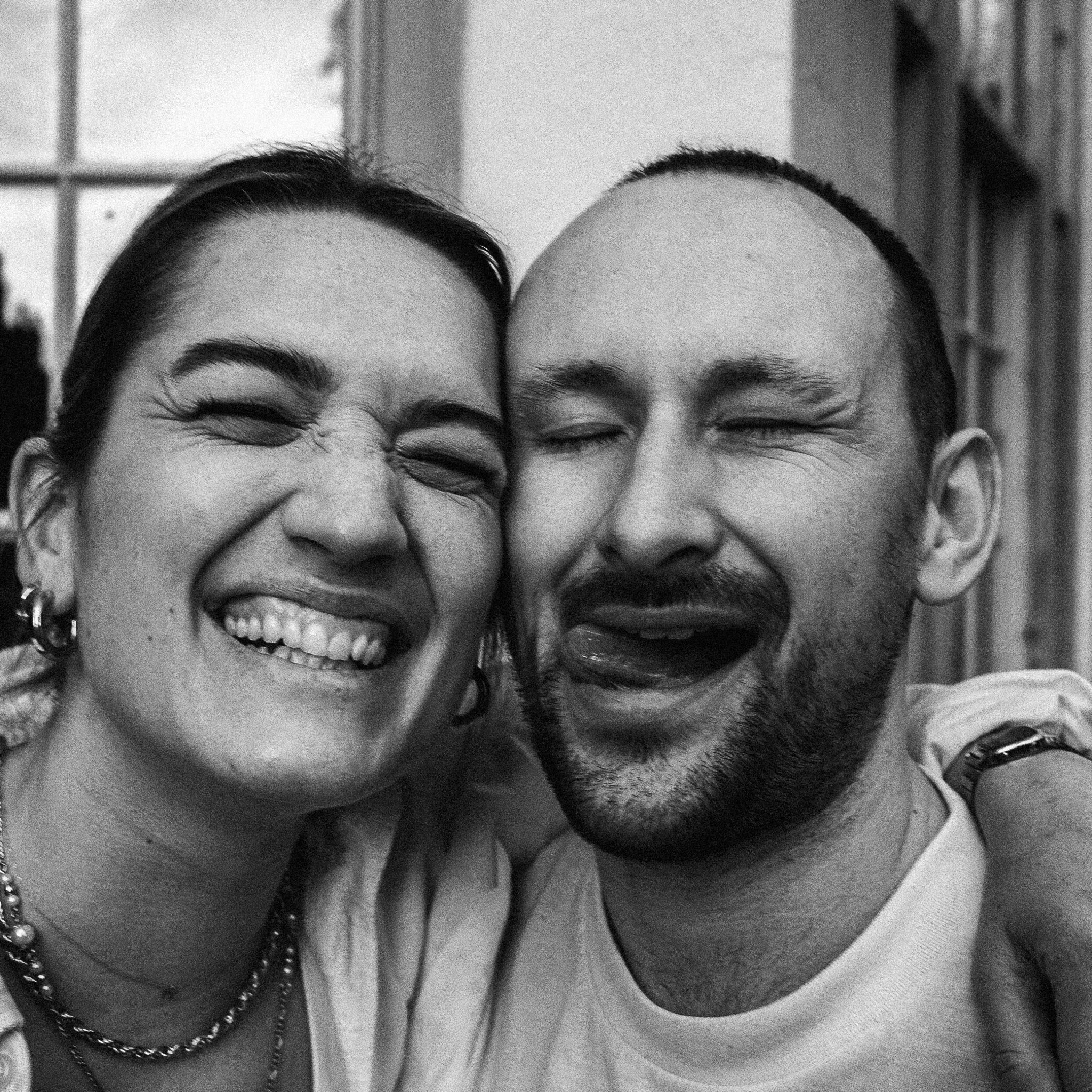 Close-up of the same couple, laughter and warmth between them.