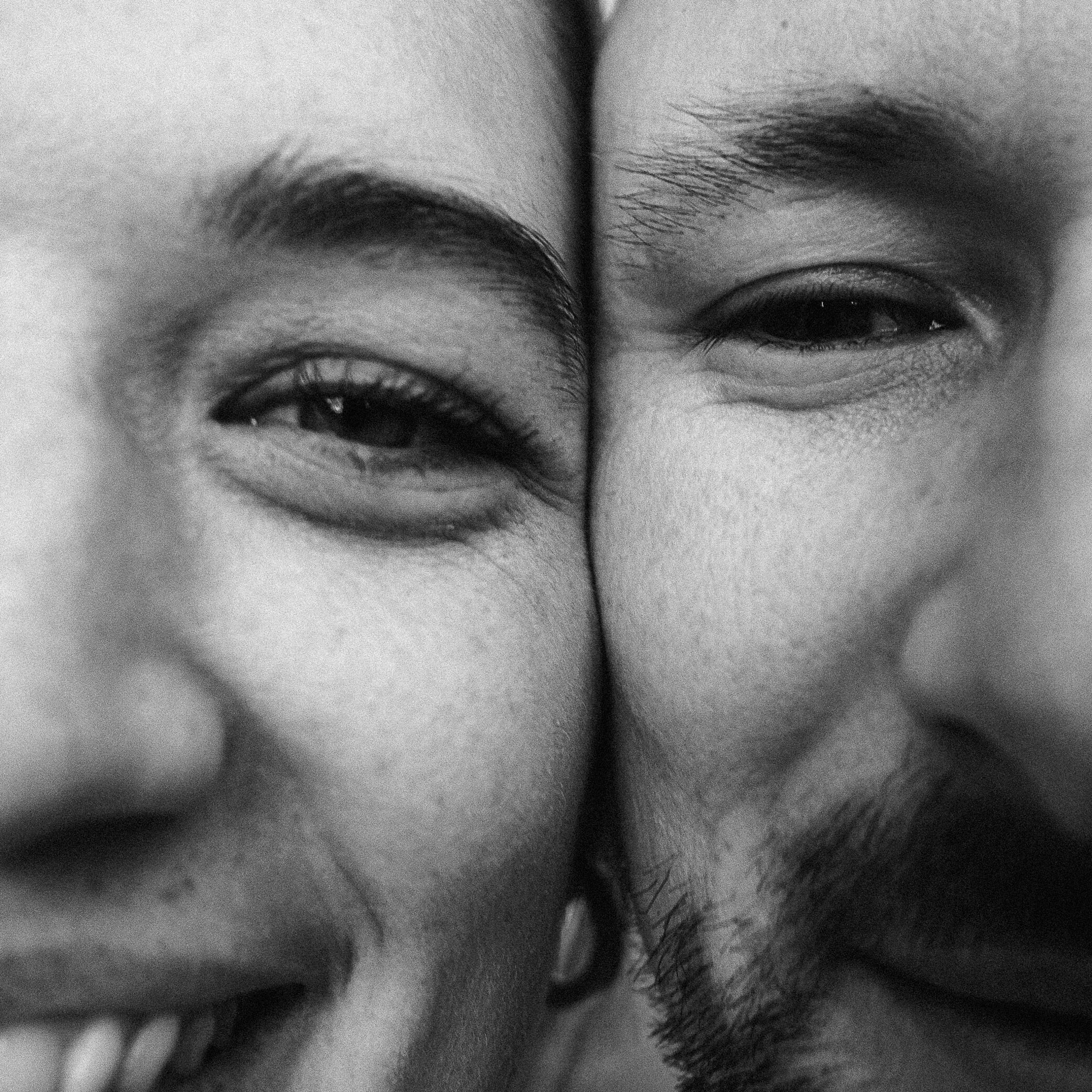 Close-up of Liam and his partner smiling warmly at the end of the day.