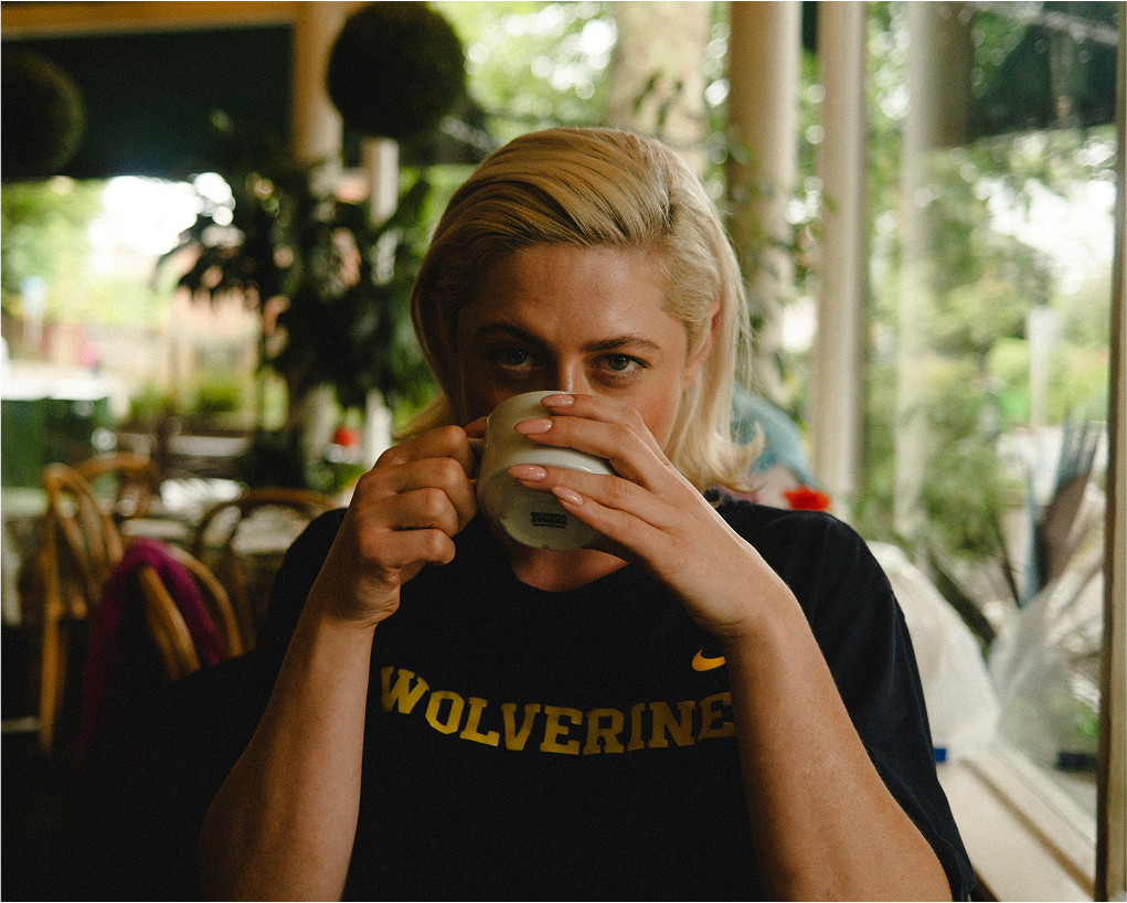 Elegant black and white portrait of Bonnie standing, contemporary portraiture at Kew Gardens, London.