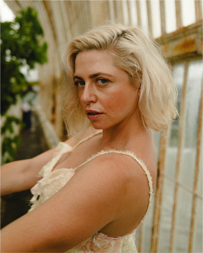 Colour portrait of Bonnie laughing, candid fine art portrait photography at Kew.