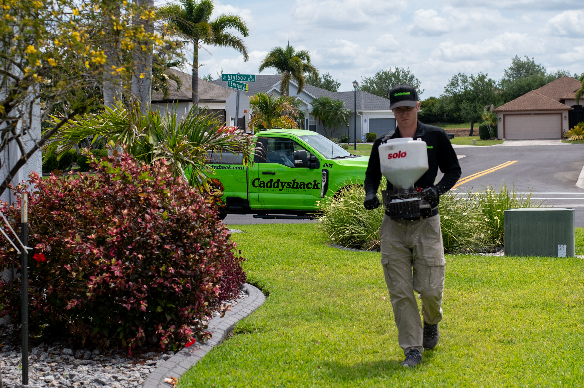 Caddyshack lawn technician applying our mosquito defense service
