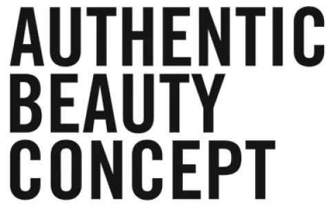 Text reading AUTHENTIC BEAUTY CONCEPT in bold uppercase letters on a black background.