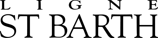 Black silhouette of a mountain range with a sun partially visible behind the highest peak.