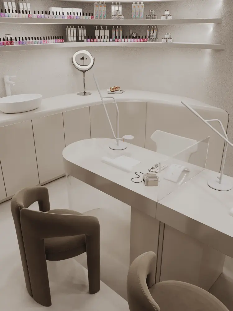 Modern nail salon station with two curved chairs, white table, clear divider, lamps, and shelves with nail polish.