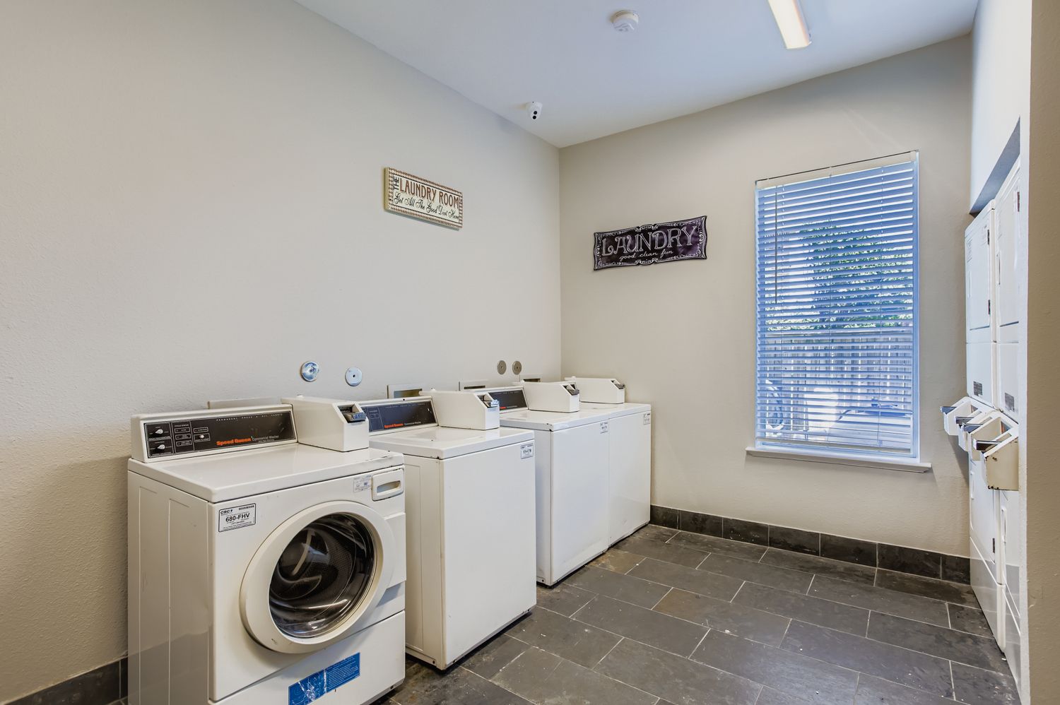 Laundry room with washer and dryer machines