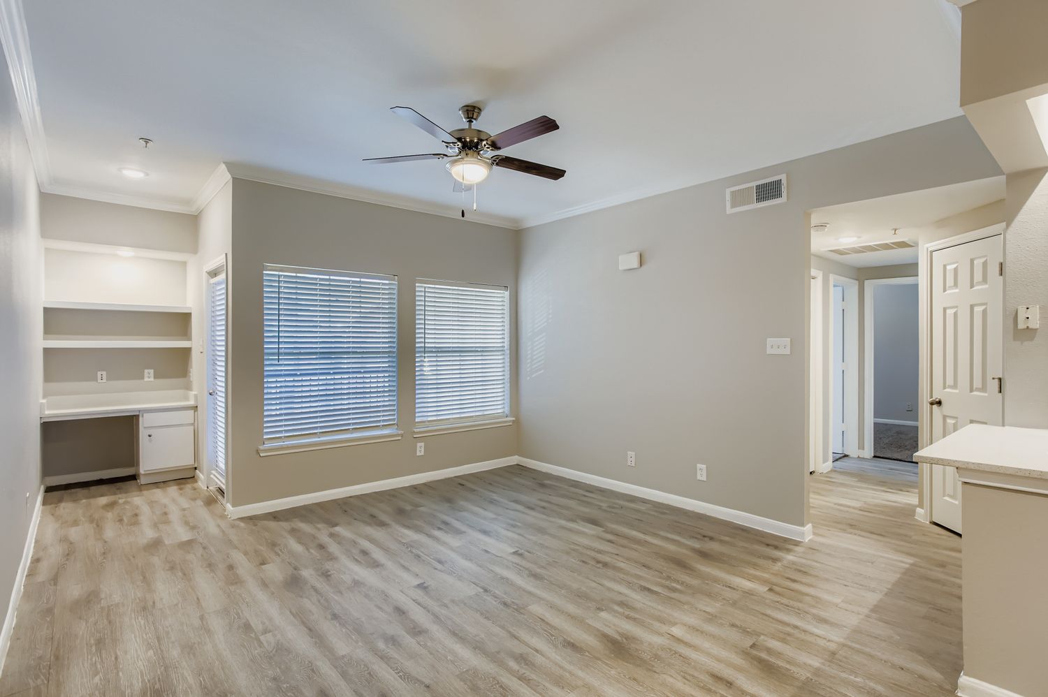 unfurnished living area with large window