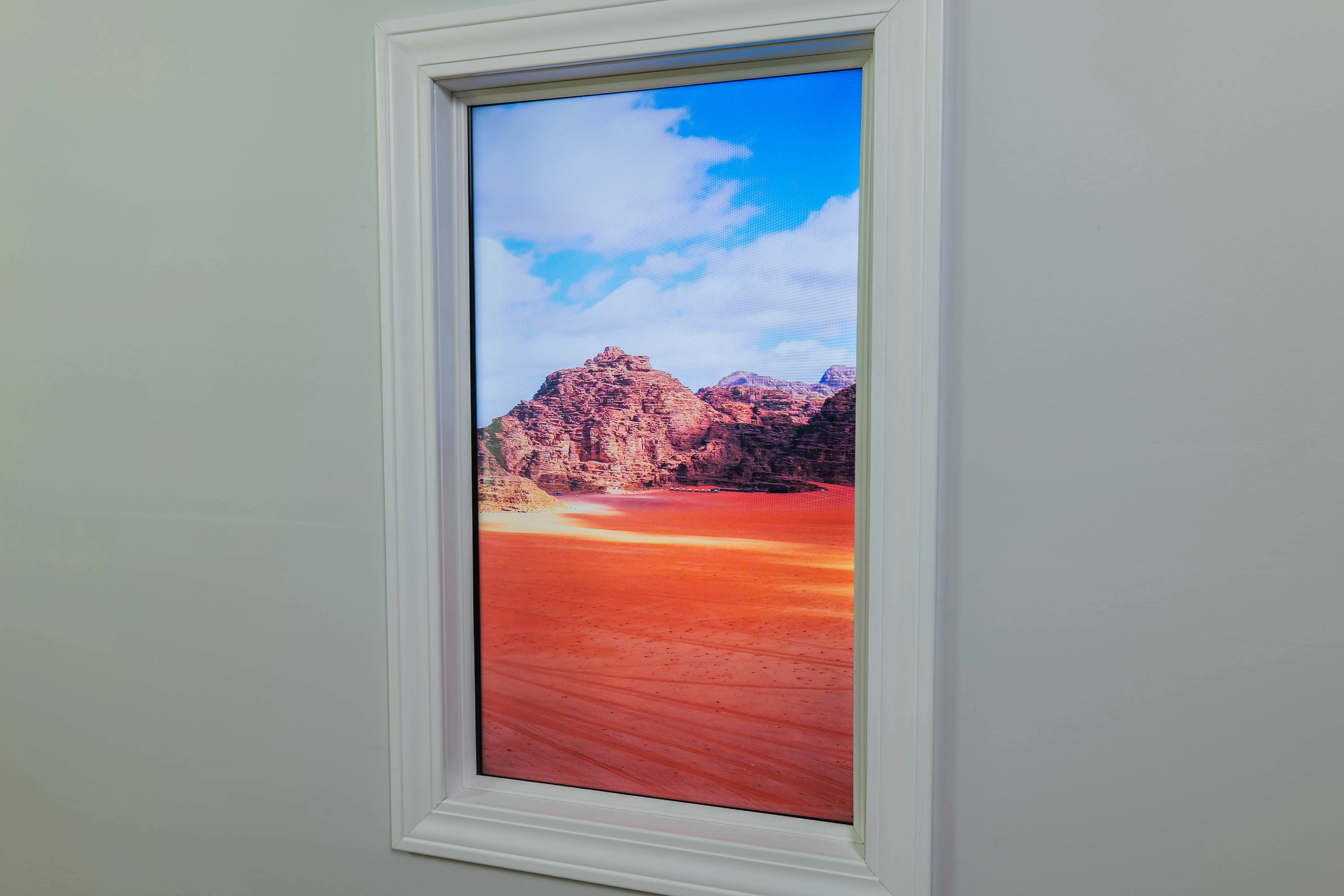 Display recessed flush into a finished wall, with the cabling and power run inside the wall