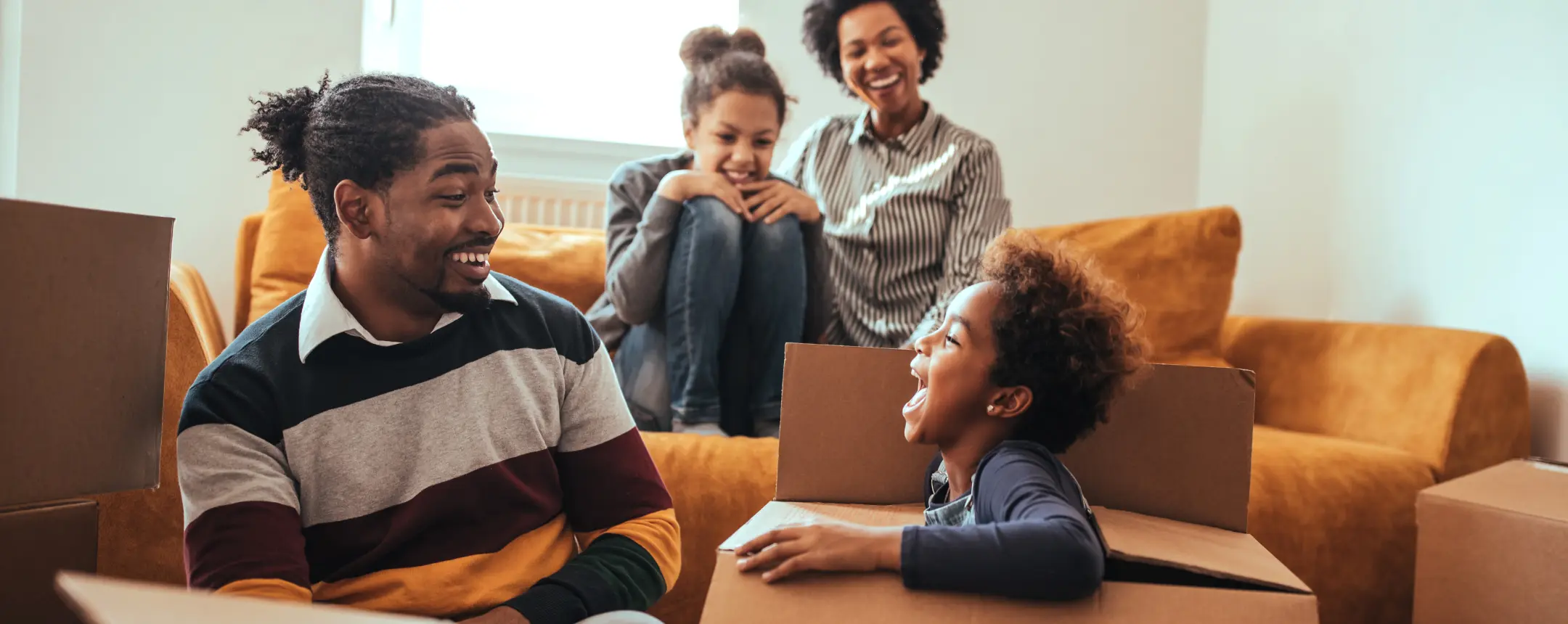 Young black family moving into a new home