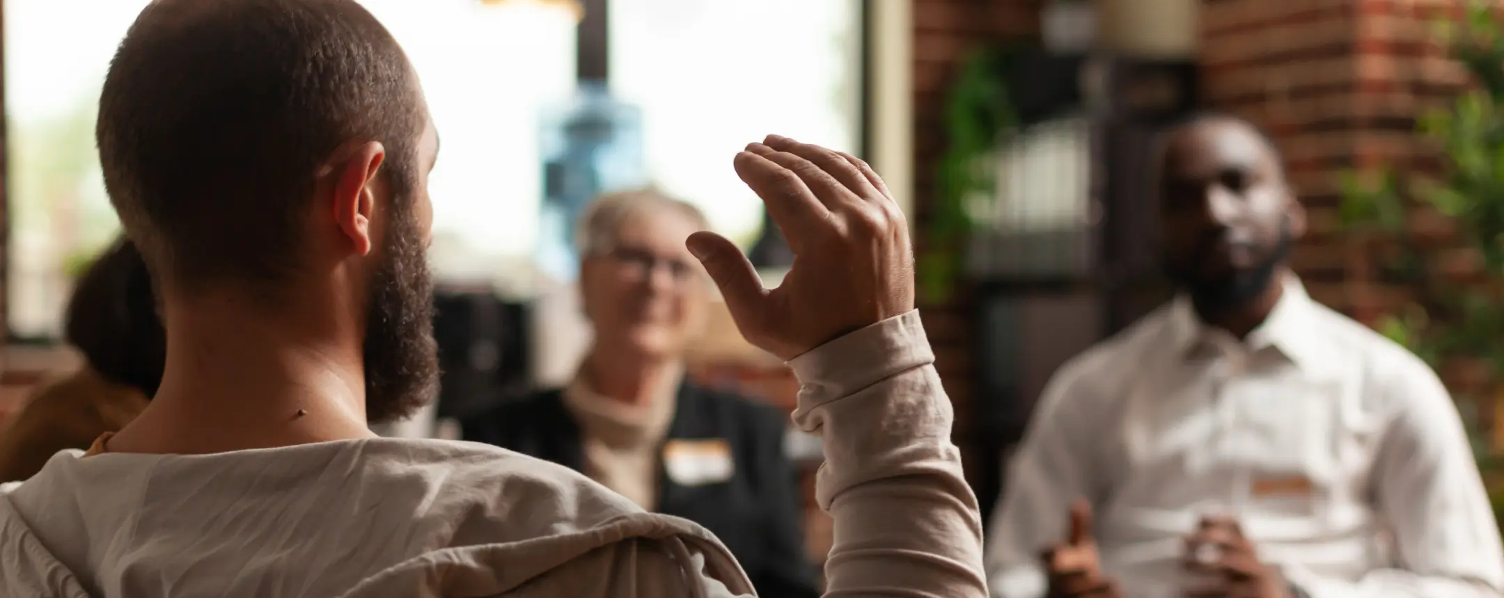 EMHIP Photo of people talking in a group