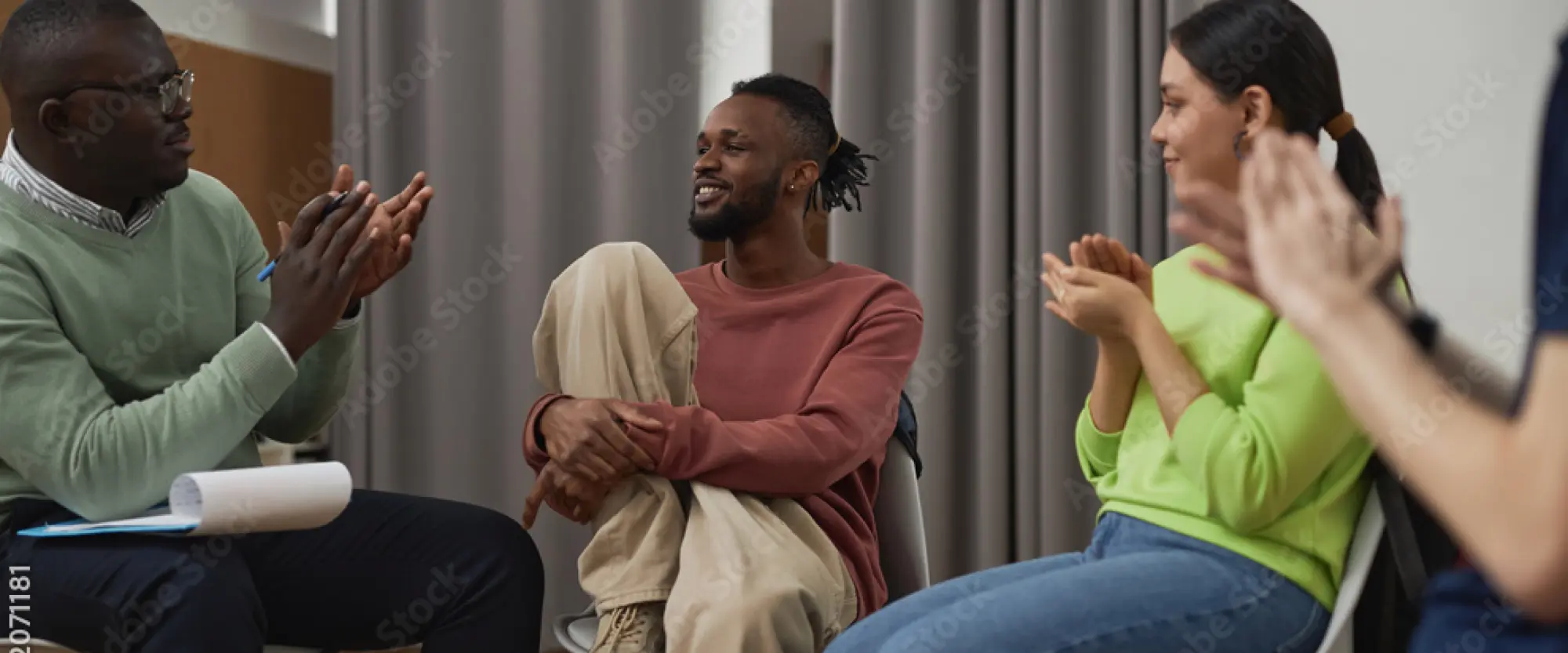 LEAP photo of a group of people, seated, talking