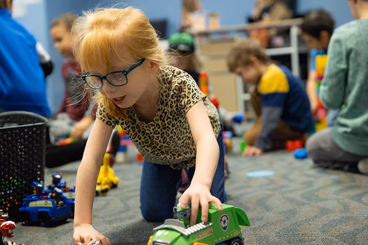 Young girl playing with a toy