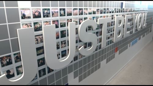 Sign that states 'Just Be You' with picture behind it.